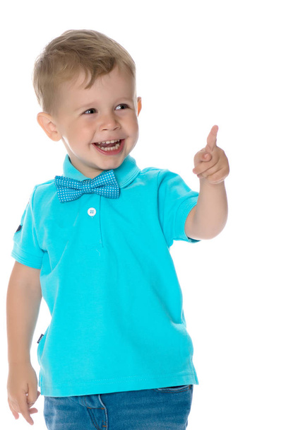 Little boy is showing a finger - Фото, изображение