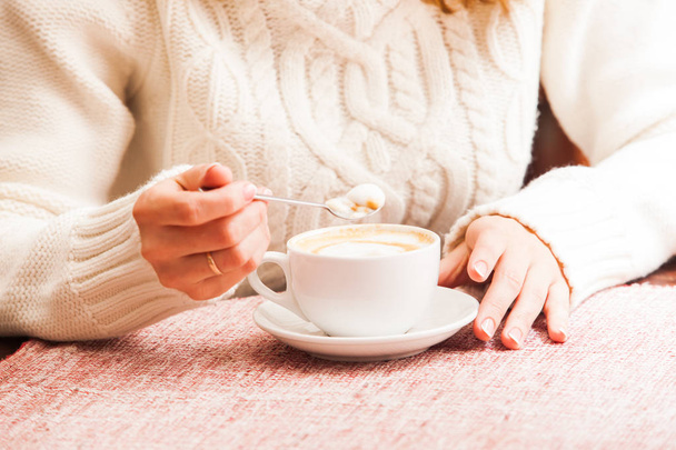Womans hands and cappuccino - Фото, изображение