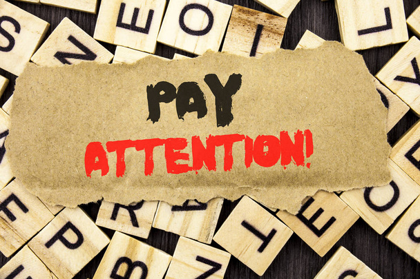 Handwriting Announcement text showing Pay Attention. Concept meaning Be Careful Beware Mindful Alarm written on tear paper note on the letter and wood background. - Photo, Image