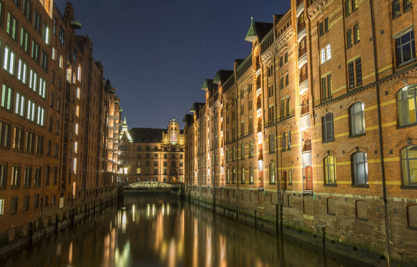 View of the bridge and the brick building in Hamburg, night illu - Photo, image