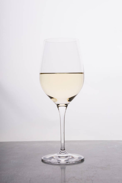 Glass of white wine on a bar counter - Zdjęcie, obraz
