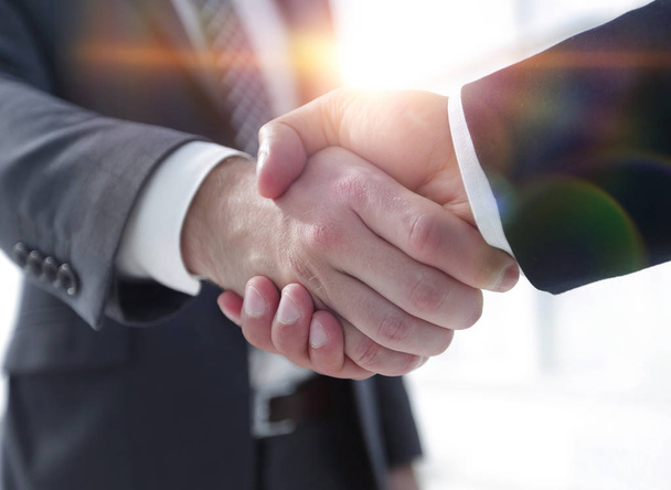 Closeup of Business Leader Shaking Partner Hand - Fotó, kép