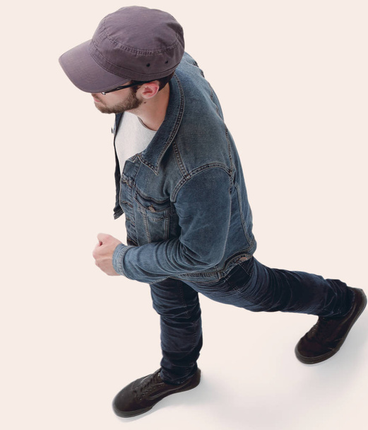 view from above. guy in a baseball cap and denim jacket - Foto, immagini