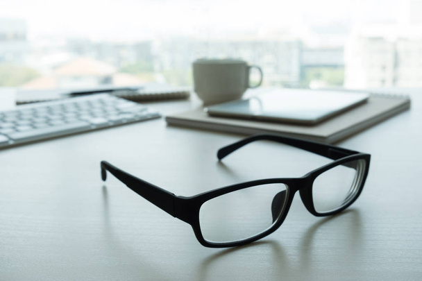 Close up of glasses and computer  business workplace work place  - 写真・画像
