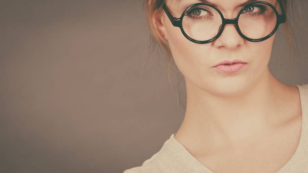 Bored focused teenage woman wearing eyeglasses - Valokuva, kuva