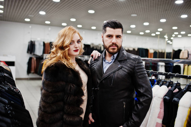 Elegance blonde girl in fur coat and stylish turkish man at the  - Foto, Bild