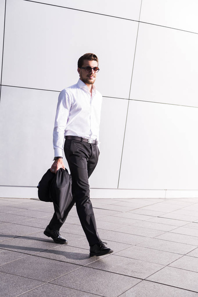 Male businessman or worker in black suit - Foto, afbeelding
