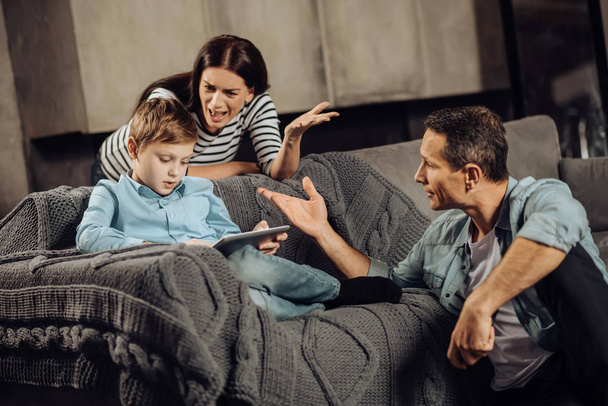 Worried parents yelling at their son for binge-playing - Photo, Image