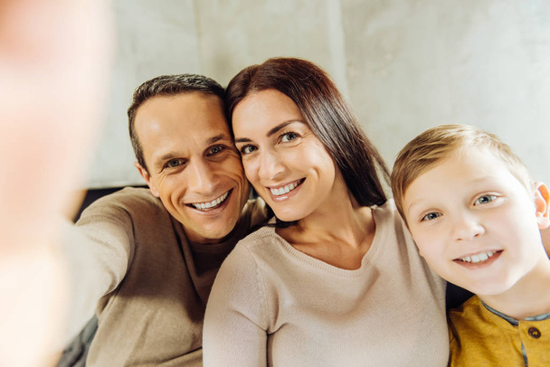 Upbeat young family taking a selfie together - Photo, Image