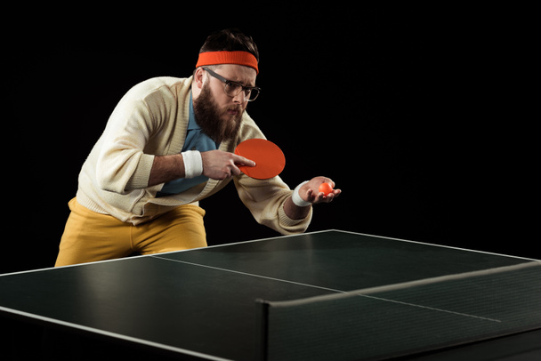 sportsman playing table tennis alone isolated on black - Photo, Image