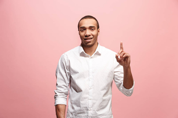 The happy business man point up, half length closeup portrait on pink background. - Фото, изображение