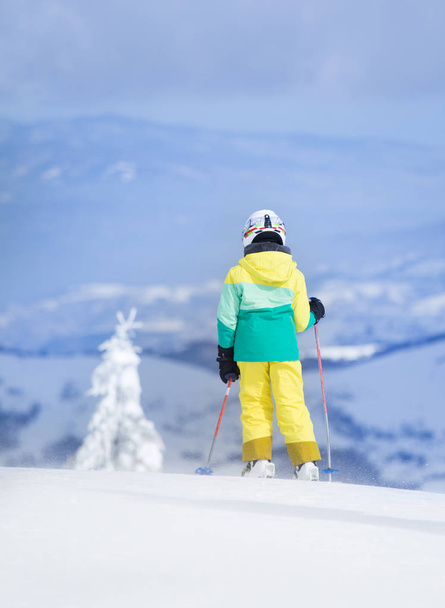 Child skiing on mountain peak - Fotó, kép