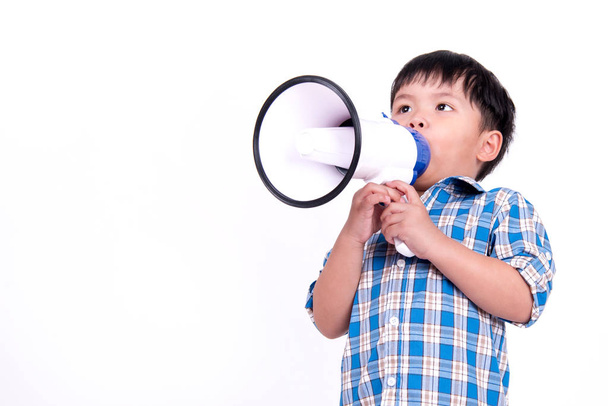 Young boy shouts into the megaphone in the blue plaid shirt. - Foto, Imagem