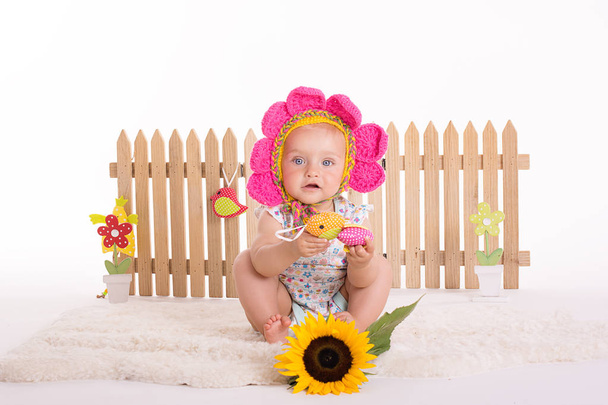 Happy smiling toddler sittting in a studio on a white background - Photo, Image