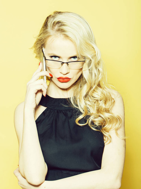 Sexy blonde in glasses with phone - Φωτογραφία, εικόνα