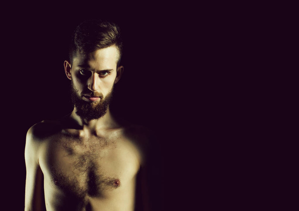 slim bearded man with thin bare torso isolated on black - Fotografie, Obrázek