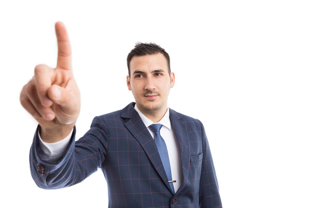 Modern businessman touching invisible screen or displa - Photo, image