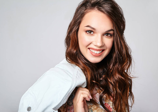 Portrait of young stylish laughing girl model in colorful casual summer clothes with natural makeup isolated on gray background. Looking at camera - Φωτογραφία, εικόνα