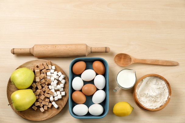 Set of kitchenware and products on wooden background. Cooking master classes - Photo, image