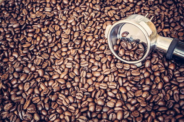 Espresso machine scoop on coffee beans background - Photo, Image