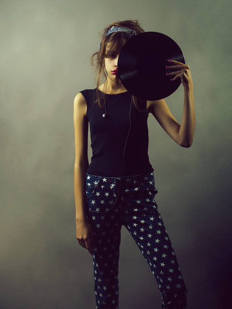 girl with headset and vinyl record - Fotó, kép