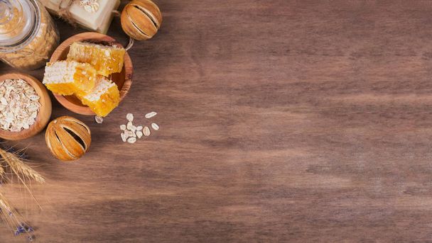 Honeycomb, sea salt, oatmeal and handmade soap with honey - Photo, image