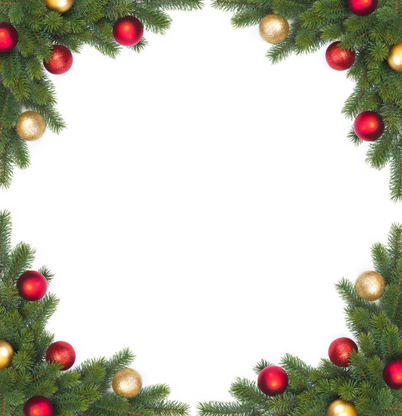 Corner Christmas fir branch with Christmas balls on a white background  - Fotó, kép
