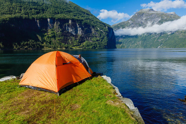 Norwegian fjord landscape with camping tent. Norway adventure. - Φωτογραφία, εικόνα