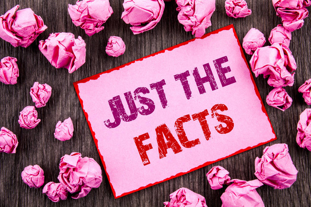 Handwriting text showing Just The Facts. Business photo showcasing Truth Fact Accuracy Honest Concept For Factual Actual  written on Pink Sticky Note Paper Folded Paper on wooden background - Photo, Image