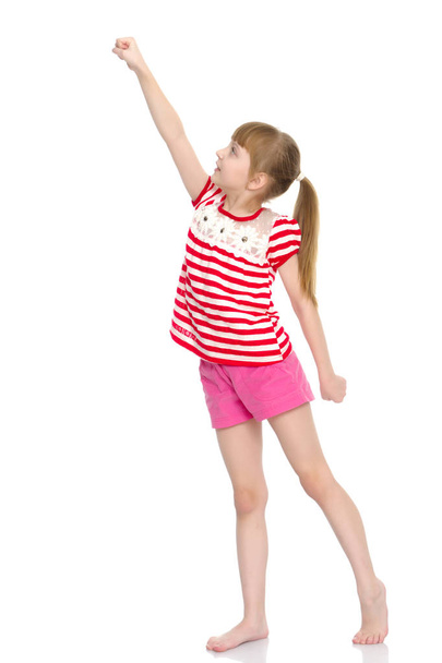 A little girl does gymnastic exercises. - Φωτογραφία, εικόνα