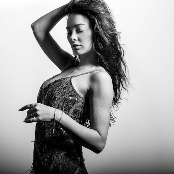 Young beautifull woman pose in studio. Black-white photo. - Photo, image