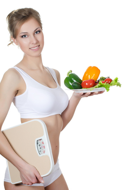 The beautiful girl with a plate with vegetables - Foto, Imagem
