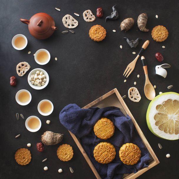 Flay lay mid autumn festival food and drink decorative items objects on black background. Text space image. - Photo, Image
