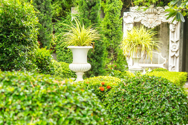 Gothic flower pot in garden. - Fotó, kép