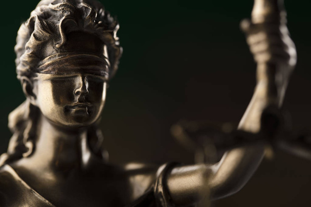 Judge concept. Themis statue on brown background. - Photo, Image