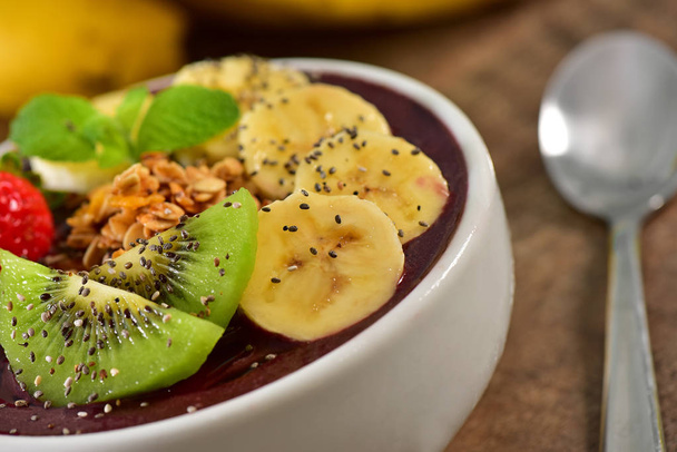 Frozen acai bowl with fruits on top - Photo, Image