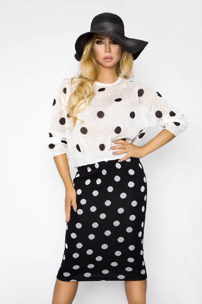 Beautiful, sexy blonde woman in elegant clothes in polka dots and a hat - Foto, immagini