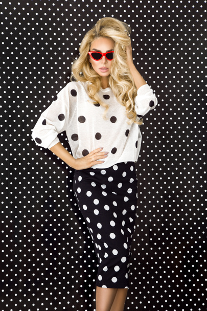 Beautiful, sexy blonde woman in elegant clothes in polka dots - Photo, Image