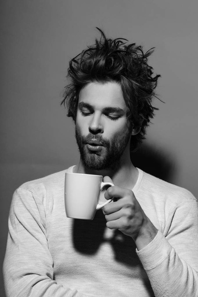 tea or coffee at man blow in cup - Foto, Imagem