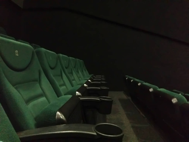 Comfy blue seats in empty cinema hall - 写真・画像