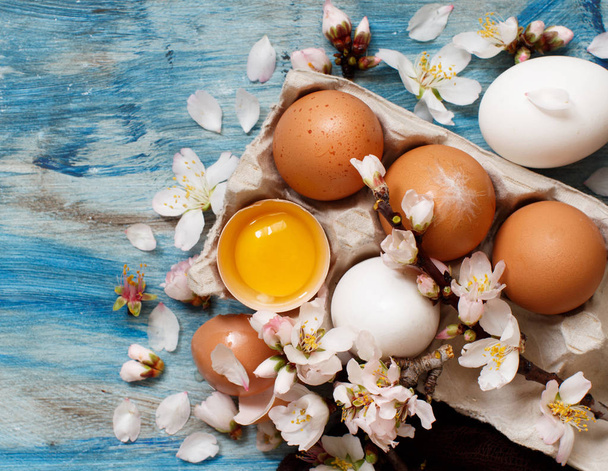 Chicken eggs and almond flowers - Photo, Image
