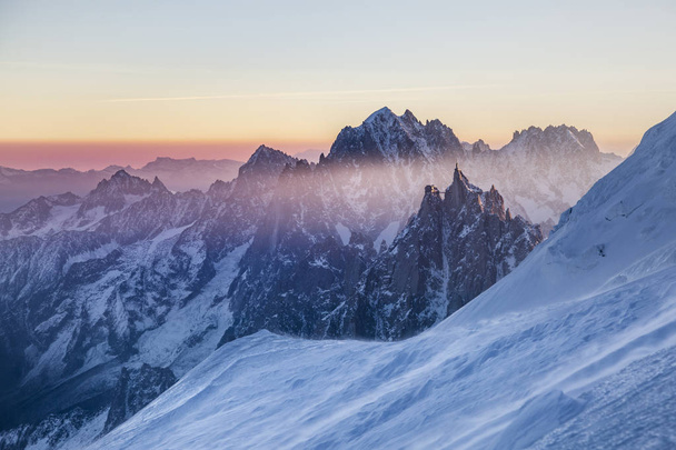 Panoramic view on rocky peaks of Aiguille du Midi at the sunrise - Photo, Image