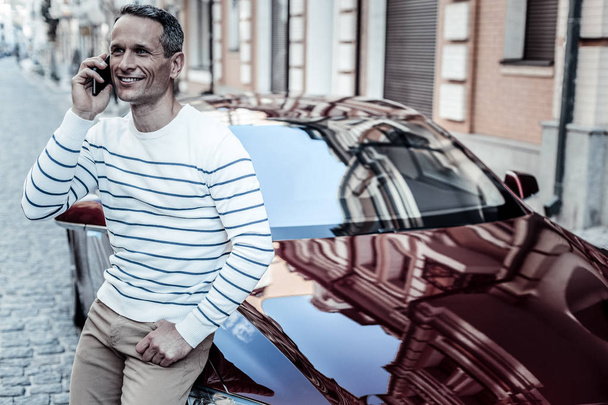 Handsome delighted man standing near his car - Photo, Image