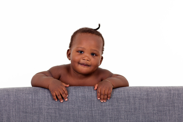 Cute african american baby boy on sofa - Foto, Imagen