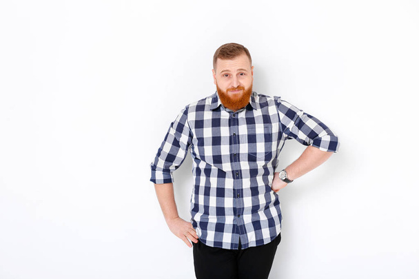 man with red hair and beard in plaid shirt - Fotografie, Obrázek