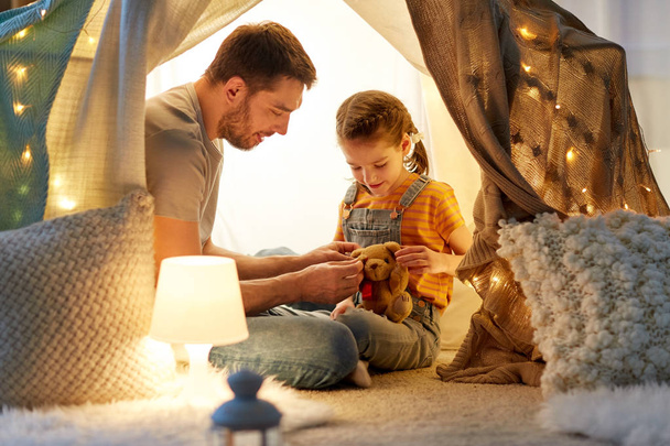 happy family playing with toy in kids tent at home - Φωτογραφία, εικόνα