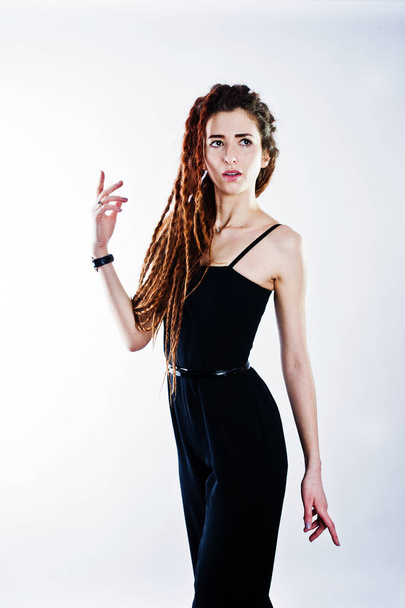 Studio shoot of girl in black with dreads on white background. - Фото, зображення