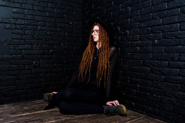 Studio shoot of girl in black with dreads, at glasses and hat on - Φωτογραφία, εικόνα