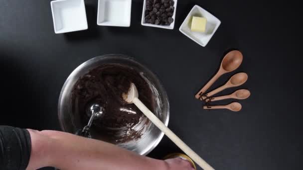 Rolling Chocolate Cookies in Powdered Sugar from Above - Materiał filmowy, wideo
