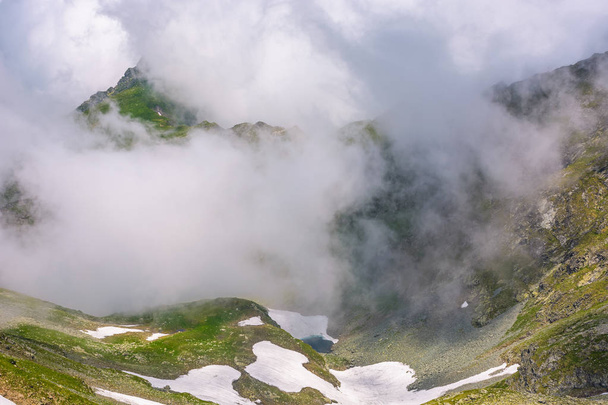 cloud formation in mountains on high altitude - Фото, зображення
